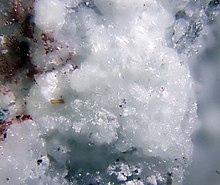 Godovikovite with red demicheleite-(Cl).jpg